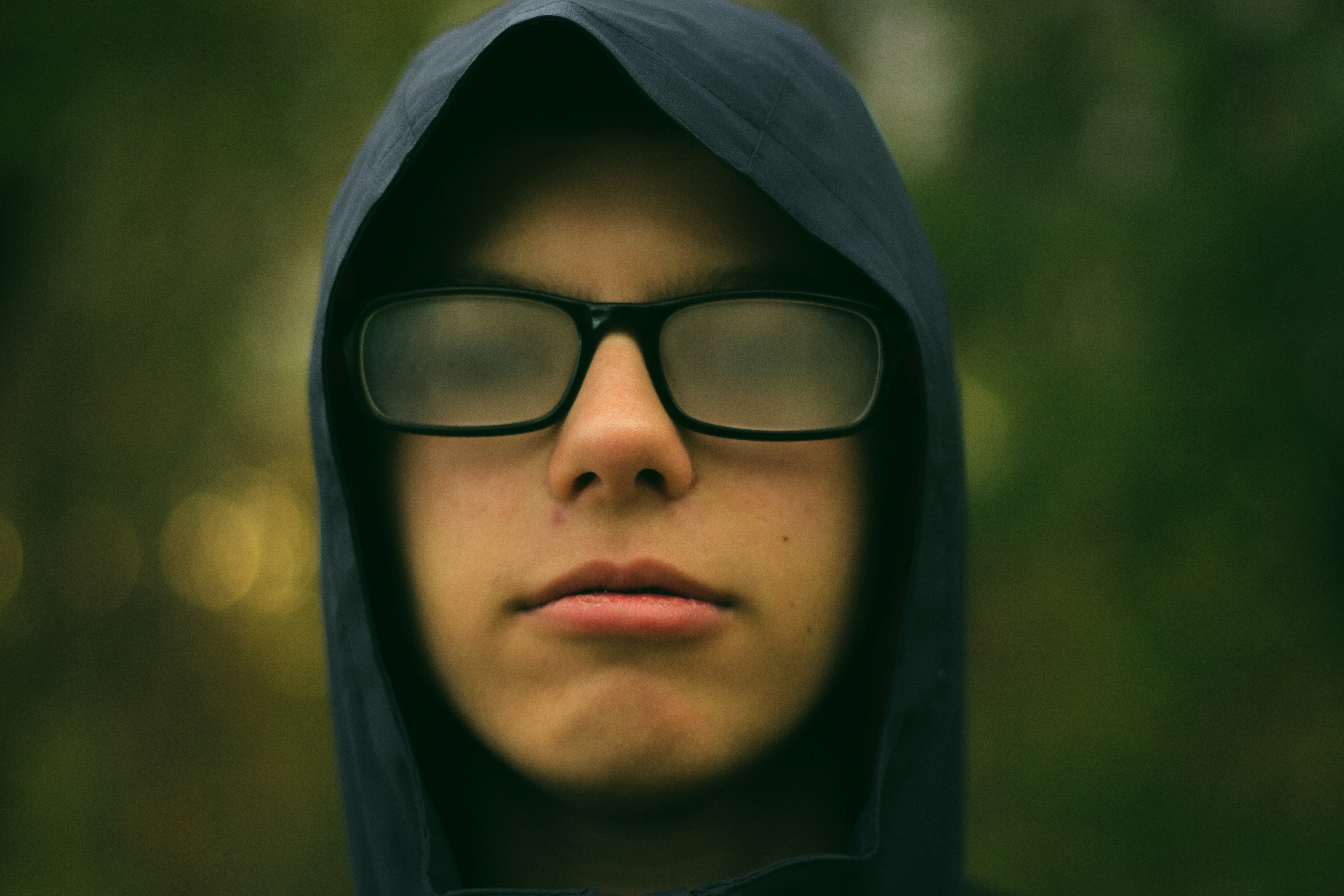 selective focus photography of man wearing eyeglasses